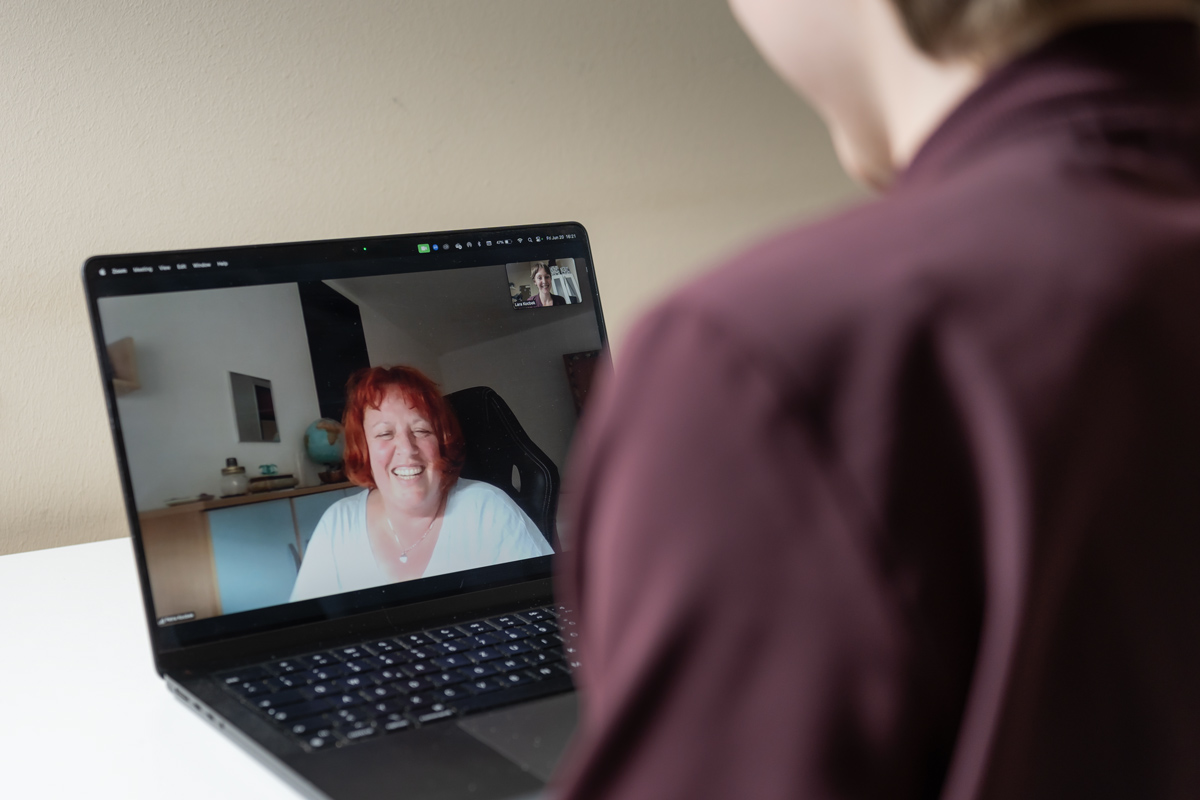 Smiling client on Zoom during a VIP Aligned Consultation with me as an owner of Lara’s Media Production.
