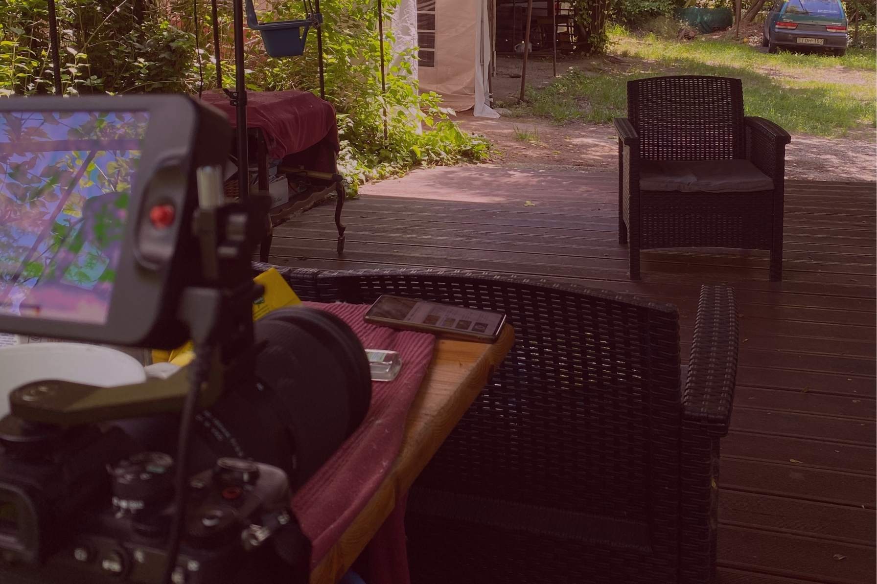 Behind-the-scenes setup of Lara’s Media Production branding photoshoot in Budapest with camera gear and natural light outdoor setting.